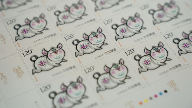 The Year of the Pig stamps have a 'happy family' theme