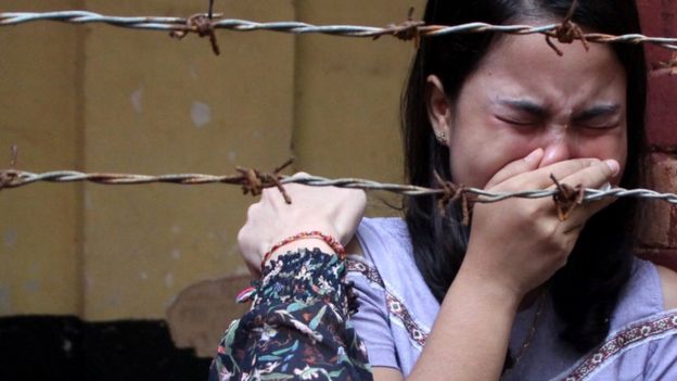 Kyaw Soe Oo's wife, Chit Suu Win, broke down in tears on hearing the verdict | Reuters
