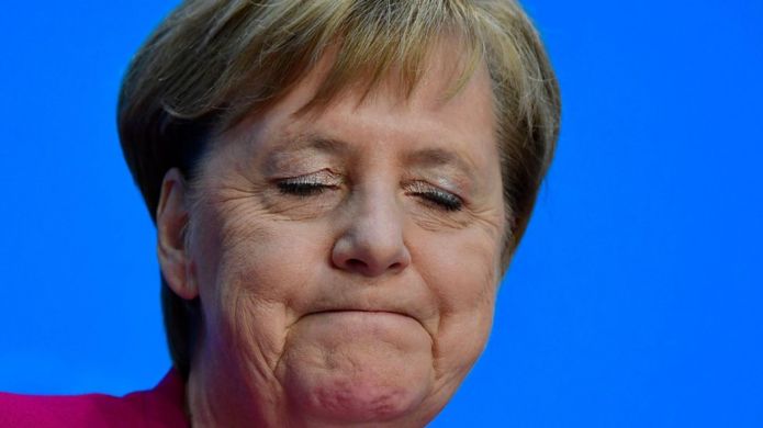 AFP German Chancellor Angela Merkel closes her eyes as she gives a press conference on 29 October Image caption Mrs Merkel gave a news conference on Monday