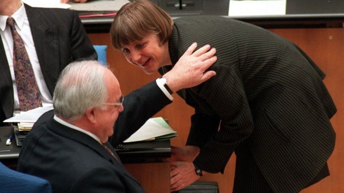 GETTY IMAGES Former German Chancellor Helmut Kohl and Angela Merkel pictured in 1997 Image caption Mrs Merkel is a veteran political figure, pictured here with former Chancellor Helmut Kohl in 1997