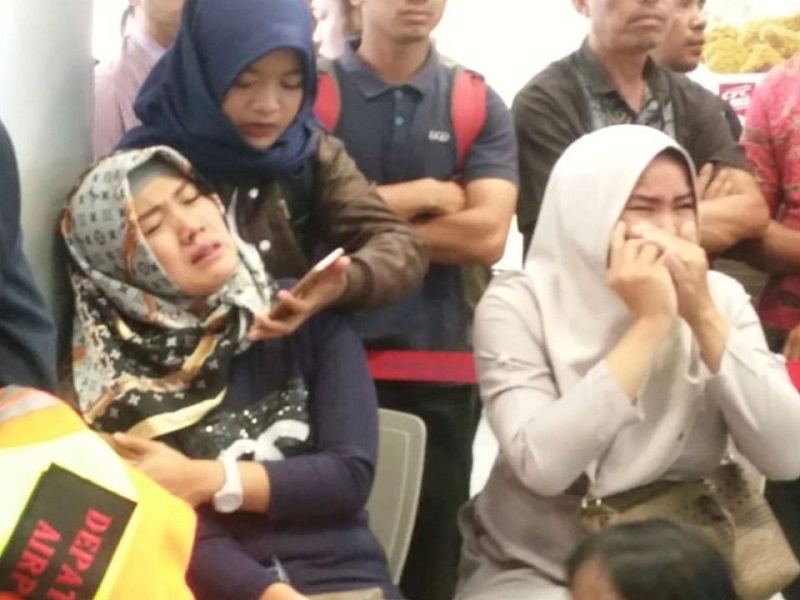 At Depati Amir airport in Pangkal Pinang, anxious relatives of passengers wait for news | Sky News