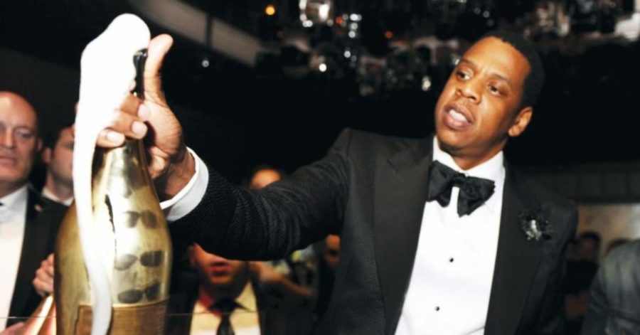 Jay-Z popping a bottle of his Armand de Brignac champagne, worth an estimated $310 million alone.

Photo: Seth Browarnik/World Red Eye